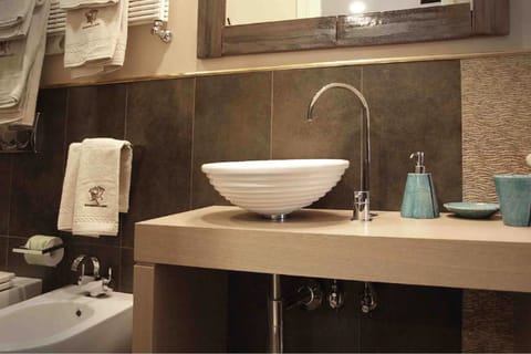 Junior Quadruple Room, Garden View (Dependance, Separate Building) | Bathroom | Shower, hair dryer, slippers, bidet