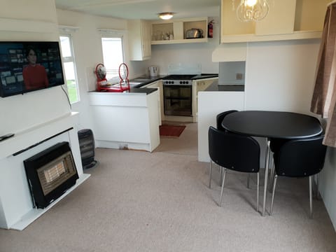 3 Bedroom Static Caravan (Double Glazed, Central Heating) | Living area | Flat-screen TV