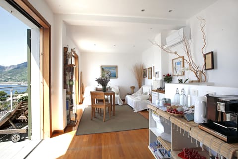 Superior Double Room, Sea View | Living room | 34-inch Smart TV with cable channels, TV, heated floors