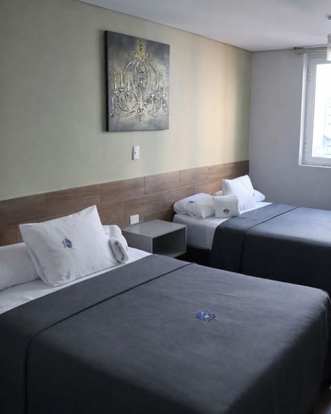 Family Room, 2 Double Beds | In-room safe, blackout drapes, iron/ironing board, free WiFi