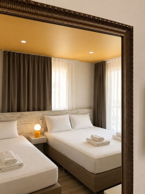 Basic Triple Room, City View | 1 bedroom, premium bedding, minibar, desk