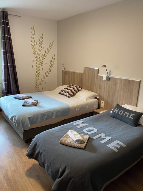 Twin Room | Individually decorated, individually furnished, desk, blackout drapes