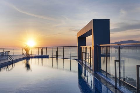 Outdoor pool, open 6:00 AM to 7:00 PM, pool umbrellas, sun loungers