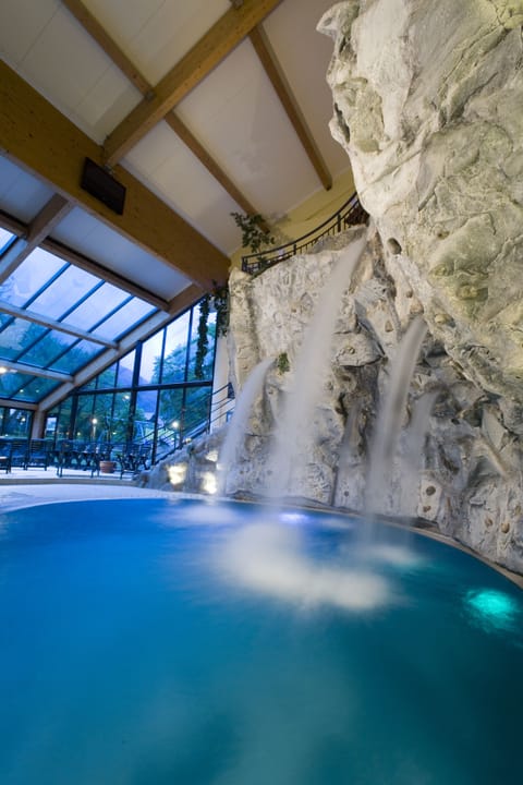 Indoor pool, outdoor pool, pool umbrellas, sun loungers