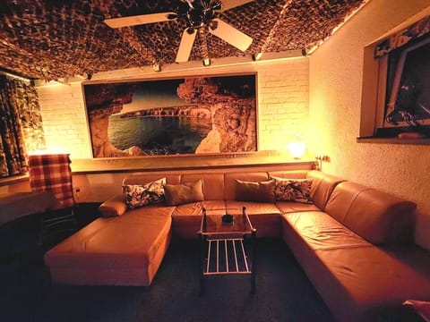 Standard Triple Room | Living area | Flat-screen TV