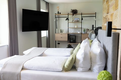 kessler.suite | Desk, laptop workspace, blackout drapes, iron/ironing board