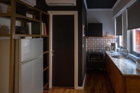 Superior Apartment, Courtyard View | Private kitchen | Fridge, stovetop, coffee/tea maker, electric kettle