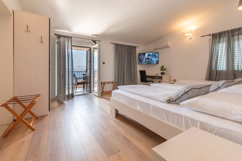 Apartment, 2 Bedrooms, Sea View | In-room safe, desk, blackout drapes, free WiFi