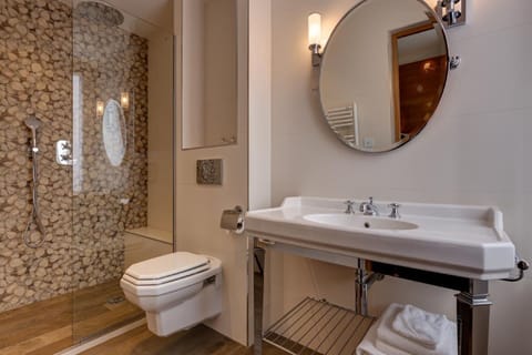 Shower, rainfall showerhead, hair dryer, towels