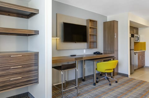 Desk, laptop workspace, blackout drapes, iron/ironing board