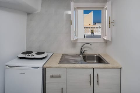 Standard Quadruple Room | Private kitchen | Fridge, electric kettle