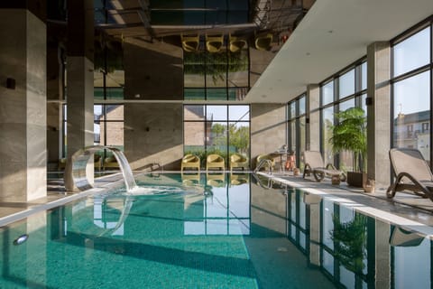 Indoor pool, seasonal outdoor pool, sun loungers, lifeguards on site