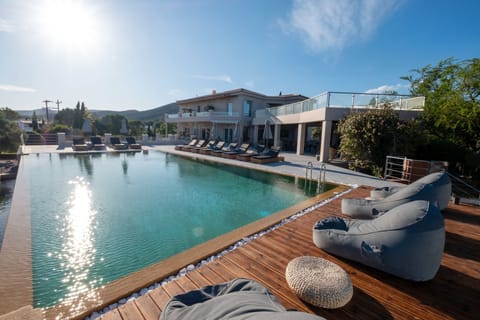 Seasonal outdoor pool, open 9:00 AM to 8:00 PM, pool umbrellas