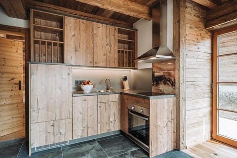 Deluxe Chalet (S`BSUNDRÈ) | Private kitchen | Full-size fridge, oven, stovetop, dishwasher