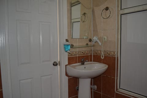 Shower, free toiletries, hair dryer, slippers