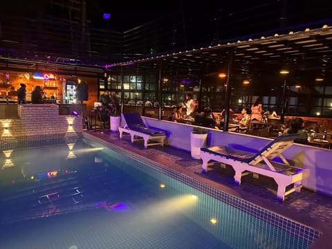 Outdoor pool, open 8:00 AM to 7:00 PM, sun loungers
