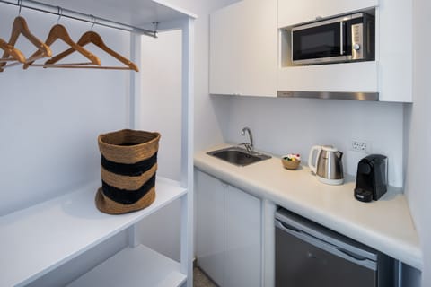 Helios Suite , Deluxe suite 1 with sea view and hot tub | Private kitchenette | Fridge, microwave, espresso maker, electric kettle