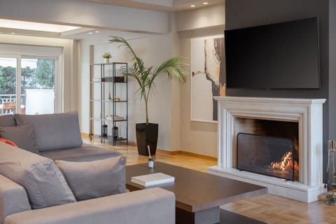 Luxury Villa | Living area | 40-inch flat-screen TV with cable channels, Smart TV, fireplace