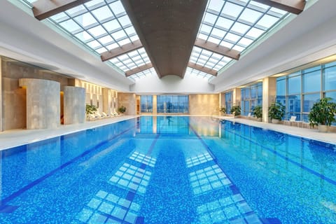 Indoor pool, open 7:00 AM to 10:00 PM, sun loungers
