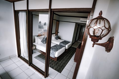 Deluxe Garden Twin with Shuttle Denpasar - Lovina - Denpasar | Minibar, in-room safe, desk, blackout drapes