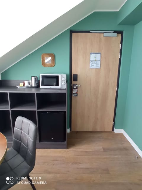 Premium bedding, desk, laptop workspace, blackout drapes