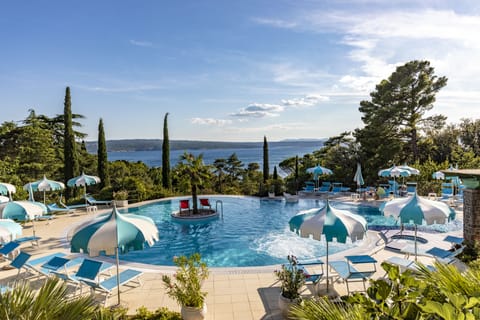 Indoor pool, outdoor pool, pool umbrellas, sun loungers