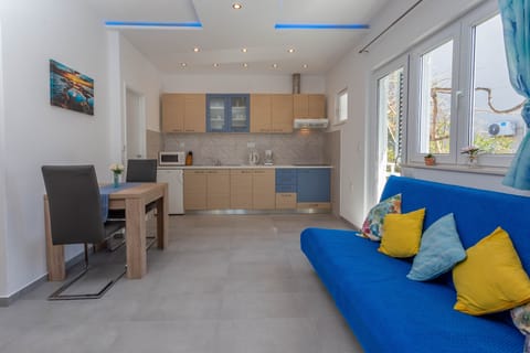 Superior Apartment | Living area | 70-cm flat-screen TV with satellite channels, TV