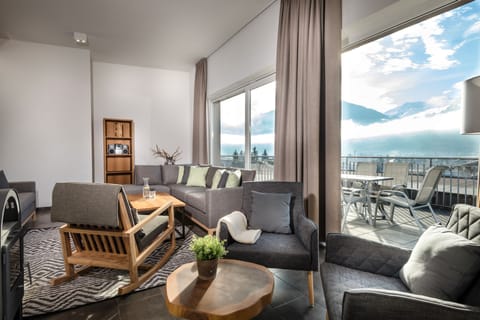 Apartment, Terrace, Mountain View (Alpine Royal) | Living area | LCD TV, fireplace
