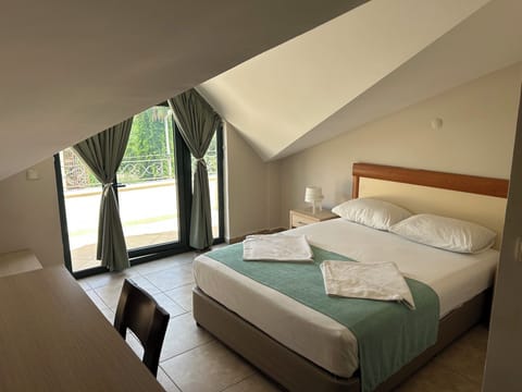 Standard Apartment | Minibar, in-room safe, iron/ironing board, free WiFi