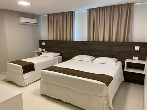 Executive Triple Room | Minibar, desk, laptop workspace, blackout drapes