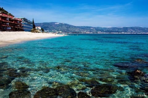 Beach nearby, white sand, sun loungers, beach umbrellas