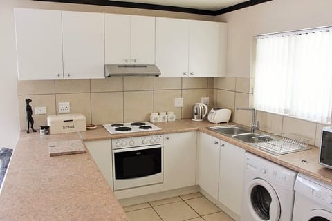 Family Apartment, Non Smoking, Pool Access | Private kitchen | Full-size fridge, microwave, oven, stovetop