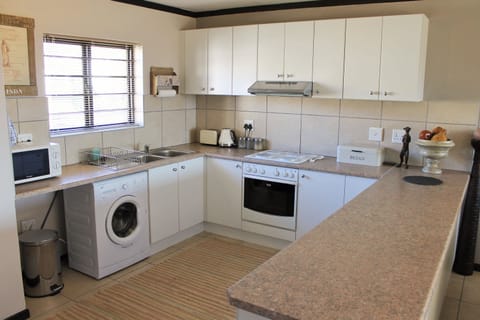 Family Apartment, Non Smoking, Pool Access | Private kitchen | Fridge, microwave, oven, stovetop