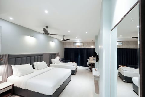 Superior Triple Room, Garden View | Pillowtop beds, desk, laptop workspace