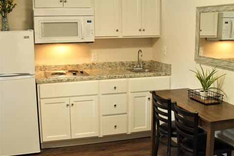 Suite, 2 Queen Beds | Private kitchen | Full-size fridge, stovetop, coffee/tea maker