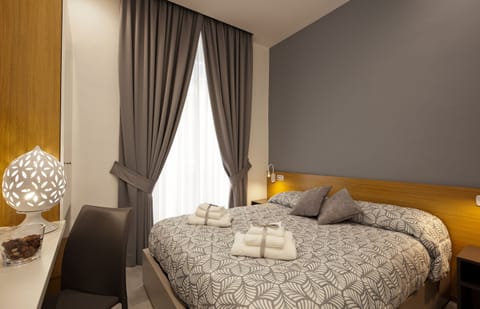 Premium bedding, down comforters, memory foam beds, desk