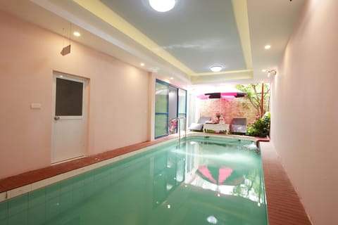 Indoor pool, pool umbrellas, sun loungers