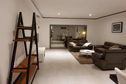 Comfort Penthouse | Living room | 40-inch flat-screen TV with satellite channels, TV