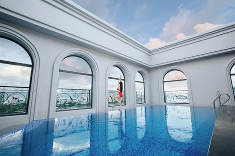 Outdoor pool, open 6:00 AM to 6:00 PM, pool umbrellas, sun loungers
