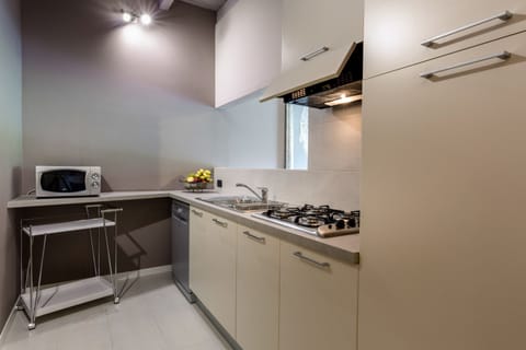 JUNIOR SUITE FAMILIARE CON 2 CAMERE DA LETTO | Private kitchen | Fridge, coffee/tea maker
