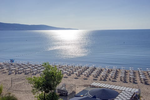 On the beach, sun loungers, beach umbrellas