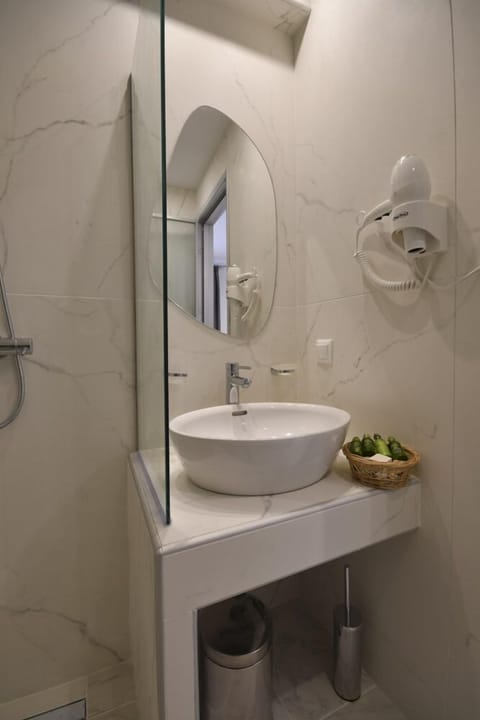 Shower, free toiletries, slippers, towels