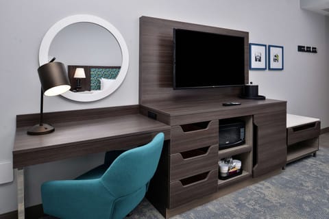 Desk, laptop workspace, blackout drapes, iron/ironing board