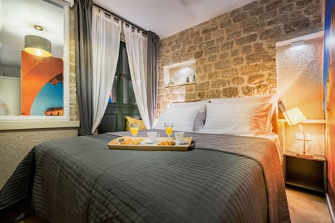 Standard Double Room | Minibar, in-room safe, desk, blackout drapes