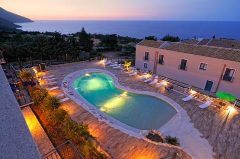 Seasonal outdoor pool, open 9:00 AM to 7:00 PM, pool umbrellas