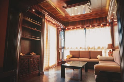 Comfort Chalet, 2 Bedrooms, Garden Area | Living room | 32-inch flat-screen TV with satellite channels, TV, fireplace