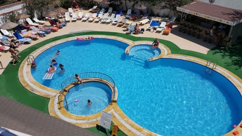 Seasonal outdoor pool, open 8:30 AM to 7:30 PM, pool umbrellas