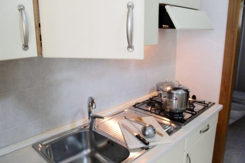 Apartment, 2 Bedrooms | Private kitchen | Full-size fridge, stovetop, coffee/tea maker, cookware/dishes/utensils