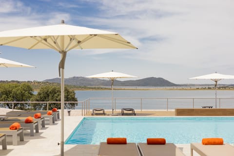 Outdoor pool, pool umbrellas, sun loungers