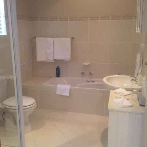 Separate tub and shower, deep soaking tub, hair dryer, towels
